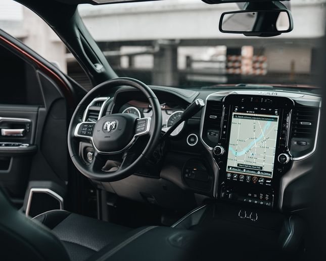 In today's modern cars, safety features like forward collision warning, automatic emergency braking, and vehicle safety communications all pose cybersecurity challenges. - Photo: unsplash.com/Brock Wegner